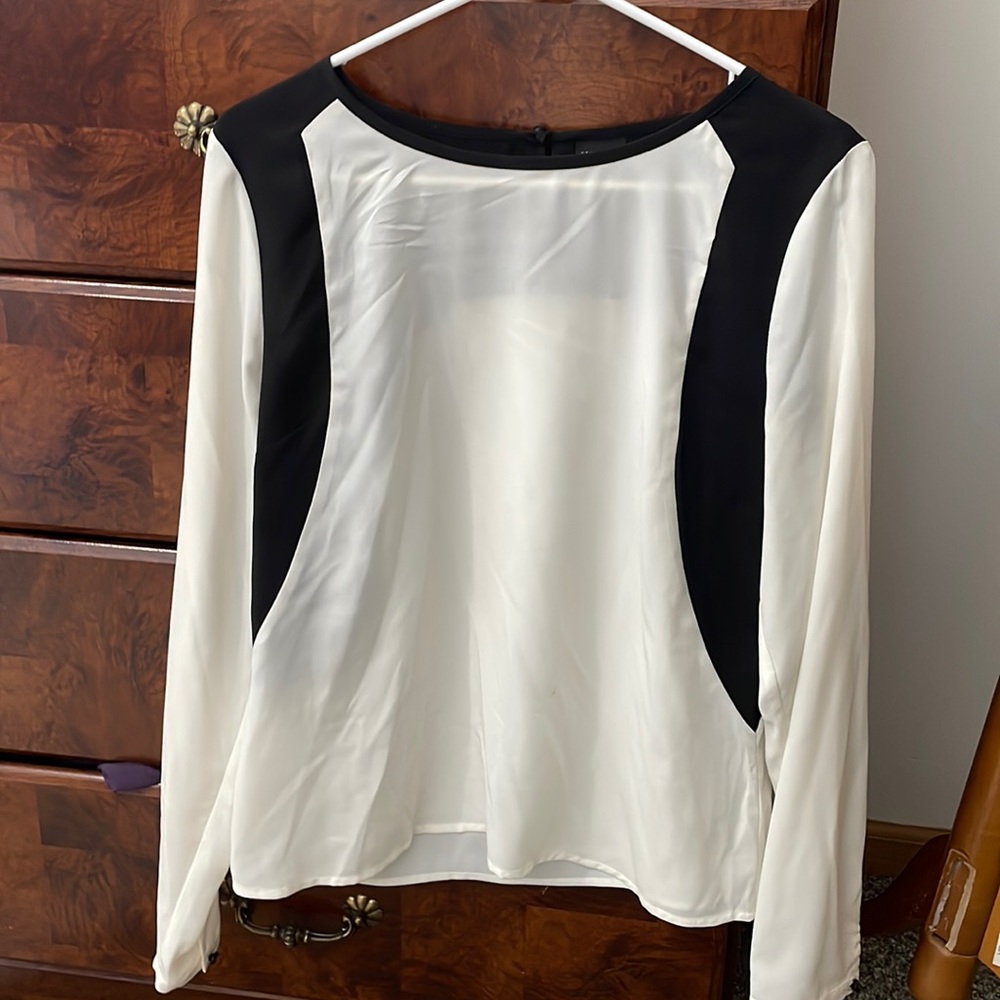 White and black chiffon blouse.